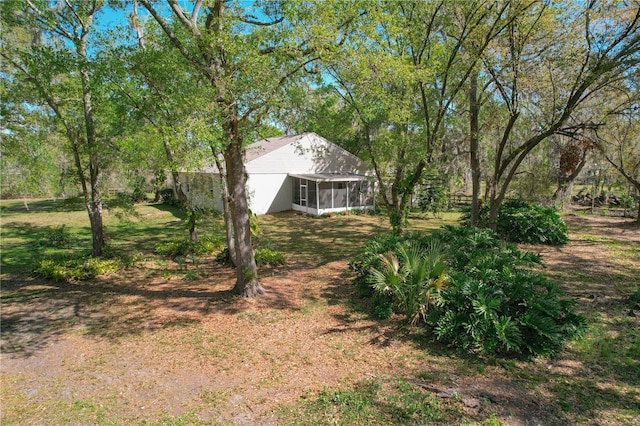 view of yard with a sunroom