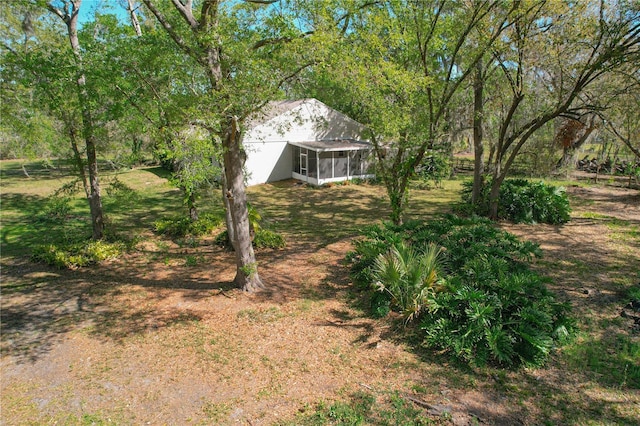 view of yard with a sunroom