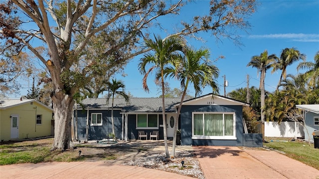 single story home with fence