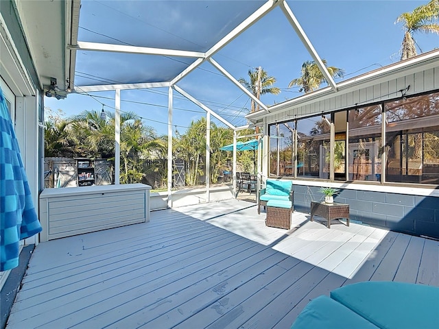 wooden deck featuring a lanai