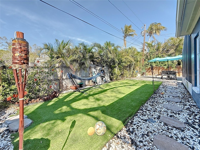 view of yard featuring a fenced backyard and a patio