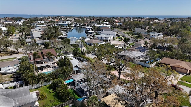 birds eye view of property featuring a water view and a residential view