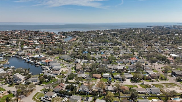 drone / aerial view with a residential view and a water view