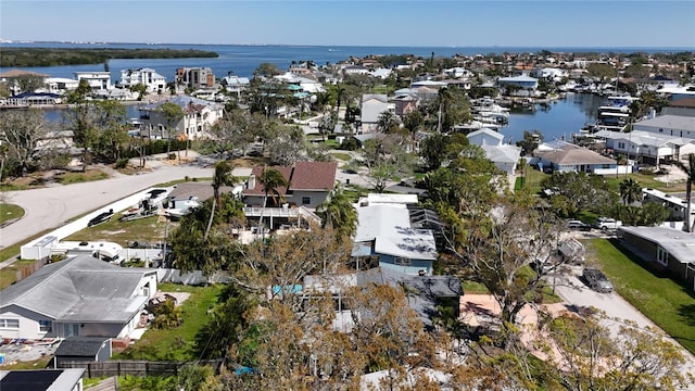 drone / aerial view with a residential view and a water view