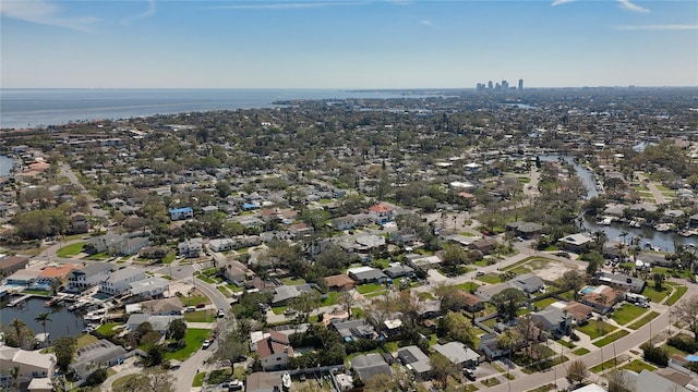 bird's eye view featuring a water view and a residential view