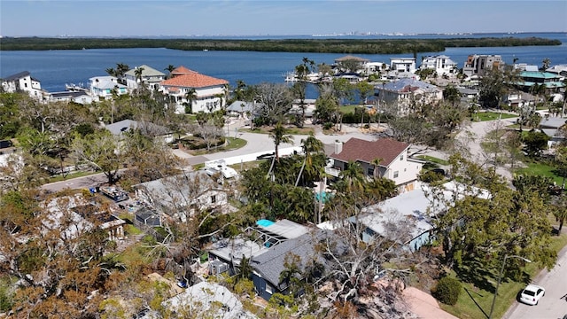 bird's eye view featuring a water view and a residential view