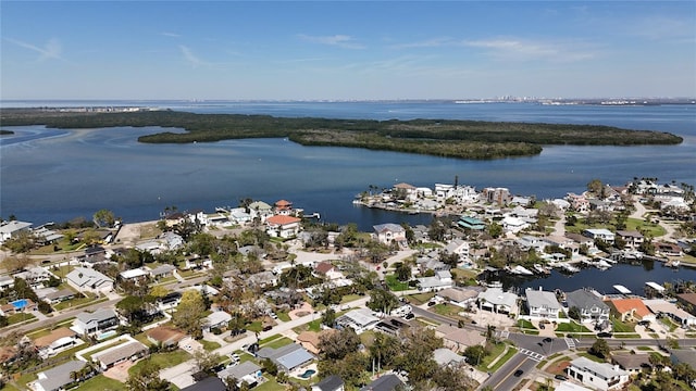 drone / aerial view featuring a residential view and a water view