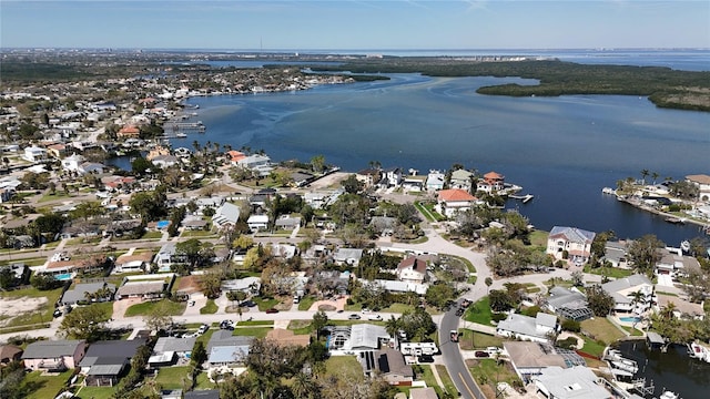 birds eye view of property featuring a water view and a residential view