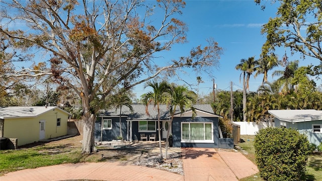 view of front of house featuring fence