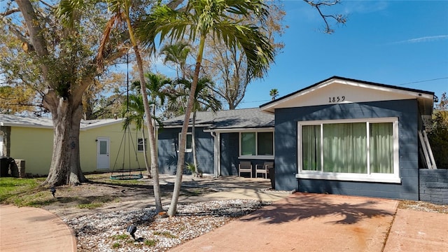 view of front of home featuring concrete block siding