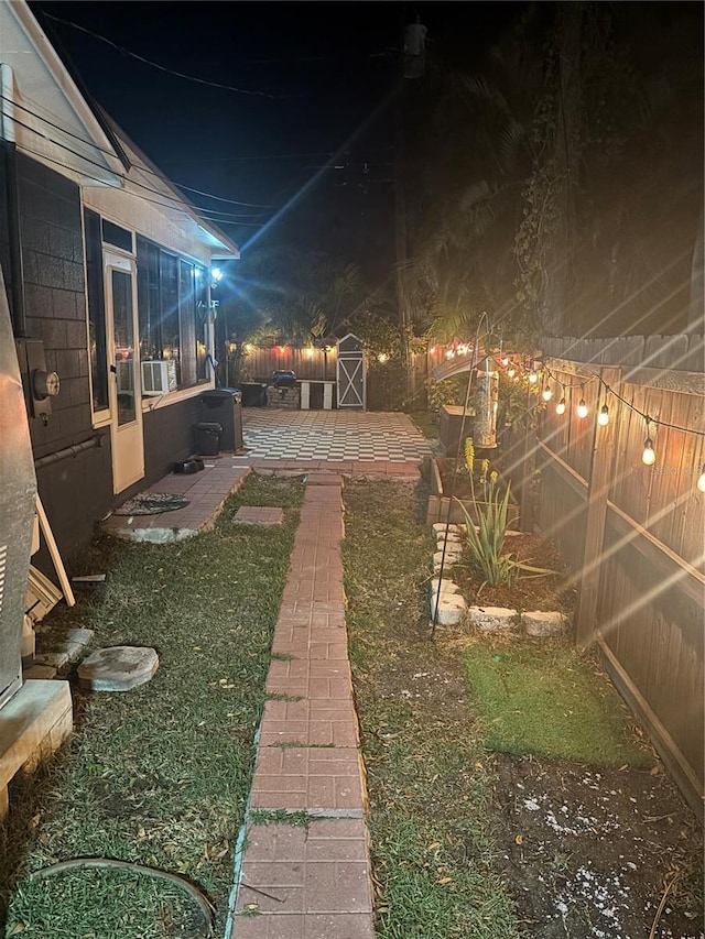 1859 Oklahoma Ave NE, Saint Petersburg, FL 33703 - yard at night featuring a fenced backyard