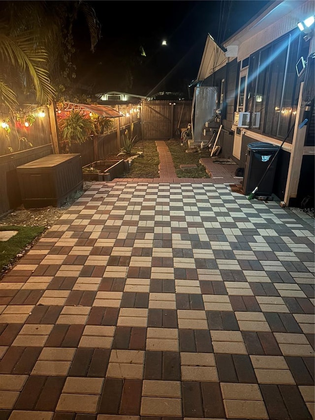 1859 Oklahoma Ave NE, Saint Petersburg, FL 33703 - patio at twilight featuring a fenced backyard