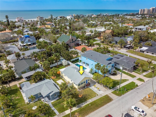 drone / aerial view featuring a water view and a residential view