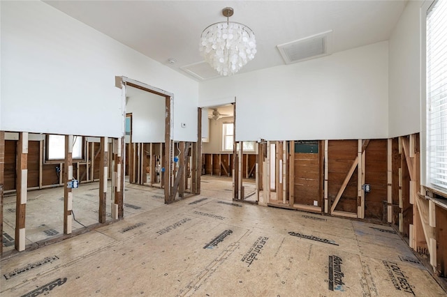 misc room with visible vents and an inviting chandelier