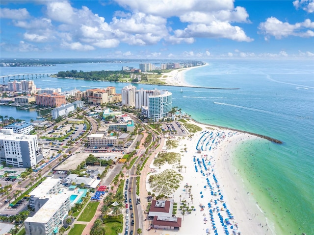 birds eye view of property featuring a view of city, a beach view, and a water view