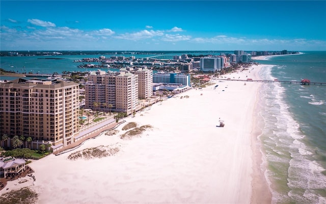 aerial view featuring a water view, a view of city, and a view of the beach