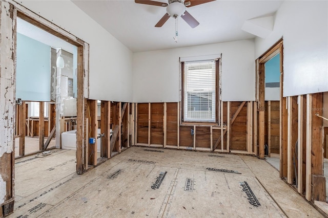 unfurnished room featuring a wealth of natural light and ceiling fan