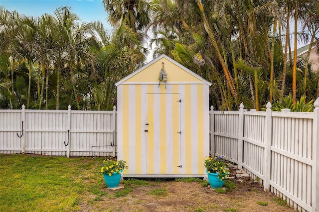 view of shed with a fenced backyard