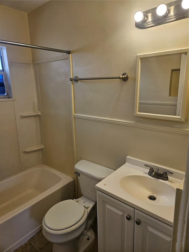 full bath with tile patterned flooring, tub / shower combination, vanity, and toilet