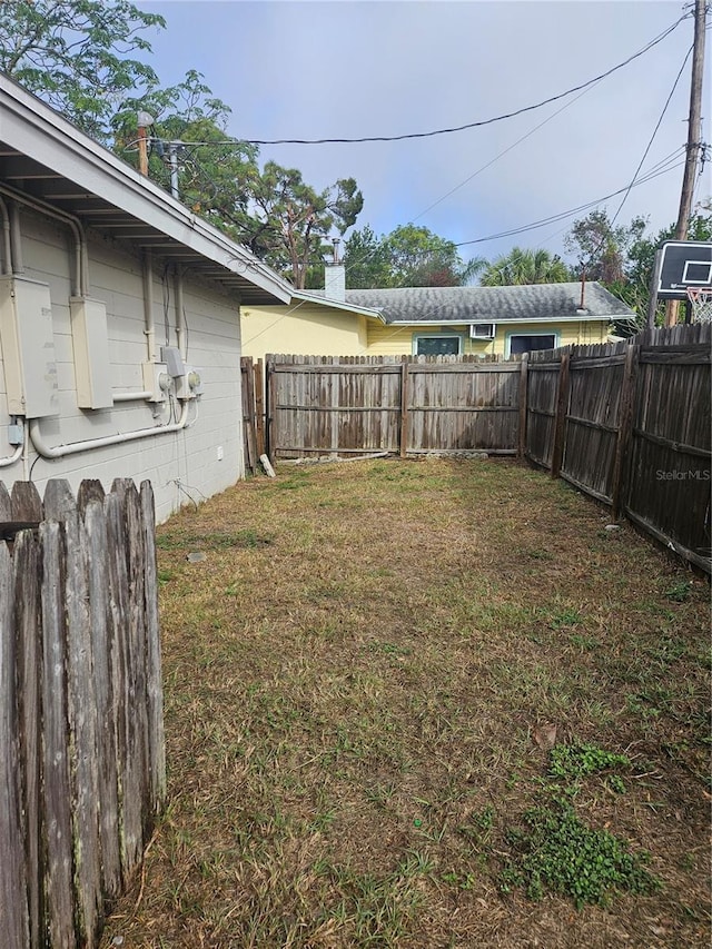 view of yard with a fenced backyard