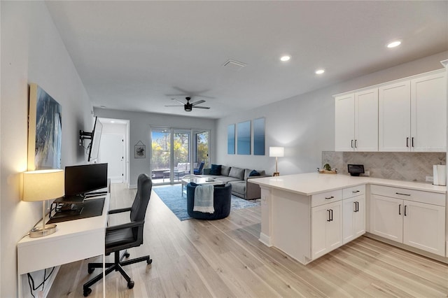 office featuring light wood-style flooring, baseboards, ceiling fan, and recessed lighting