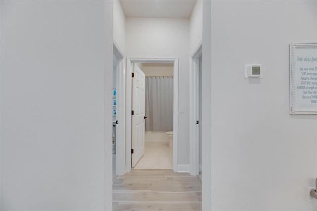 corridor featuring light wood-type flooring