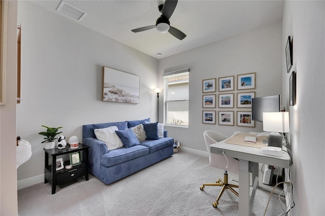 office with a ceiling fan, baseboards, visible vents, and carpet flooring