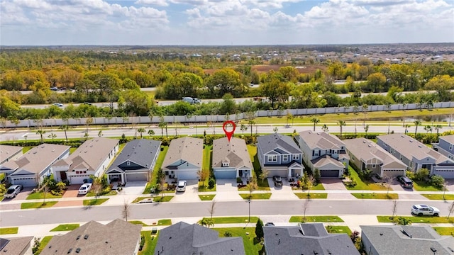 birds eye view of property with a residential view