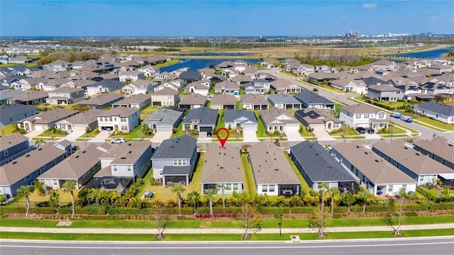 birds eye view of property with a residential view