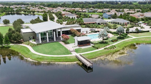 drone / aerial view with a residential view and a water view