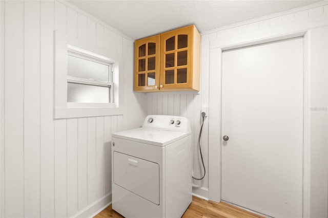 laundry room featuring laundry area, washer / clothes dryer, and light wood-style floors