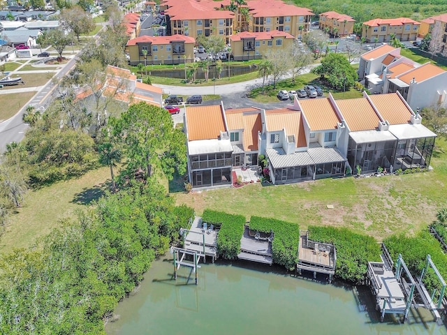 birds eye view of property with a residential view and a water view