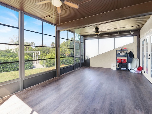 unfurnished sunroom featuring ceiling fan