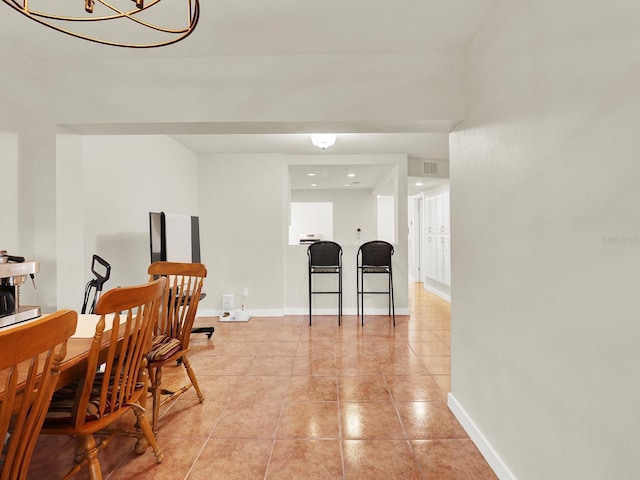 dining room with visible vents, baseboards, and light tile patterned flooring