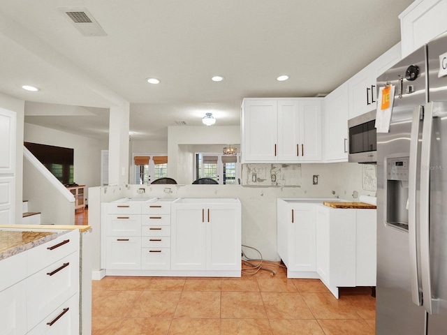 kitchen with light tile patterned floors, recessed lighting, visible vents, appliances with stainless steel finishes, and white cabinets