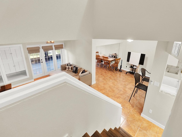 interior space featuring baseboards and tile patterned floors