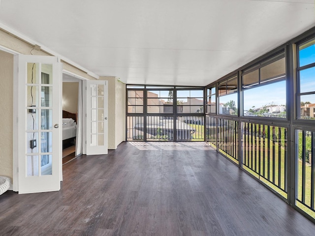 unfurnished sunroom featuring french doors