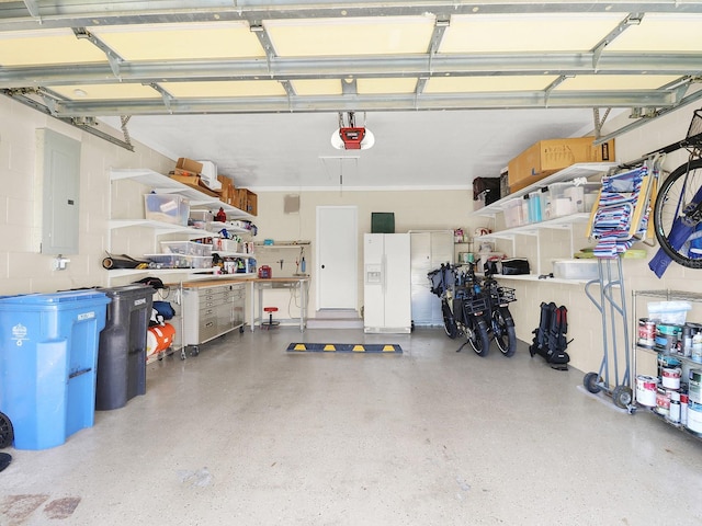 garage featuring electric panel, white refrigerator with ice dispenser, and a garage door opener