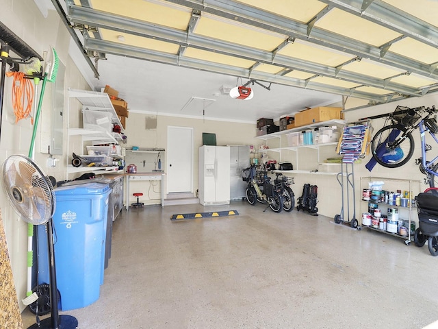 garage featuring white fridge with ice dispenser and a garage door opener