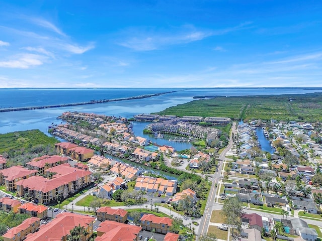 drone / aerial view with a water view and a residential view