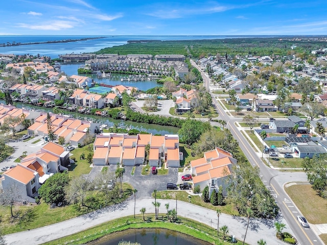 birds eye view of property with a residential view and a water view