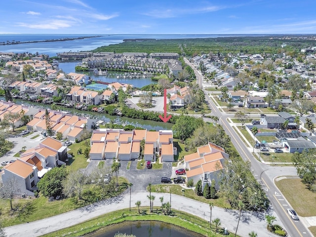 bird's eye view featuring a residential view and a water view