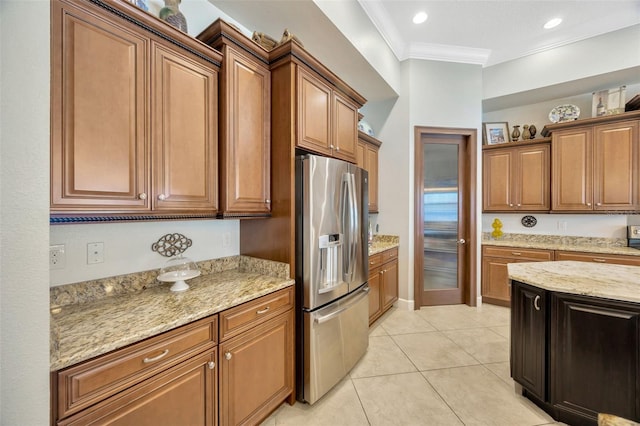 4411 Culbreath Rd, Valrico, FL 33596 - kitchen featuring light stone countertops, stainless steel fridge with ice dispenser, ornamental molding, brown cabinets, and light tile patterned flooring