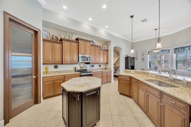 4411 Culbreath Rd, Valrico, FL 33596 - kitchen with a sink, stainless steel appliances, ornamental molding, and light tile patterned floors