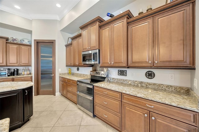 4411 Culbreath Rd, Valrico, FL 33596 - kitchen featuring light stone counters, appliances with stainless steel finishes, brown cabinetry, crown molding, and light tile patterned floors
