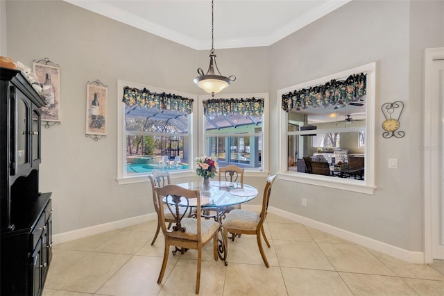 4411 Culbreath Rd, Valrico, FL 33596 - dining space featuring light tile patterned floors, baseboards, and ornamental molding