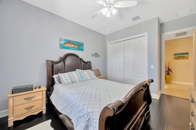4411 Culbreath Rd, Valrico, FL 33596 - bedroom with visible vents, a closet, baseboards, ceiling fan, and dark wood-style flooring