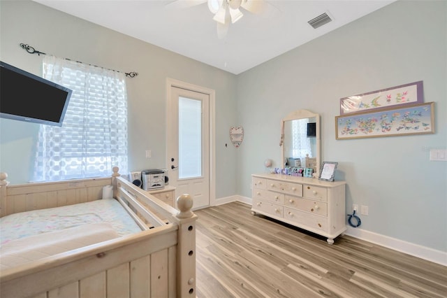4411 Culbreath Rd, Valrico, FL 33596 - bedroom featuring light wood-type flooring, visible vents, baseboards, and a ceiling fan