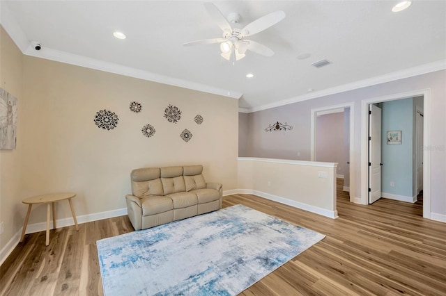 4411 Culbreath Rd, Valrico, FL 33596 - living area featuring visible vents, baseboards, ornamental molding, and light wood-style flooring