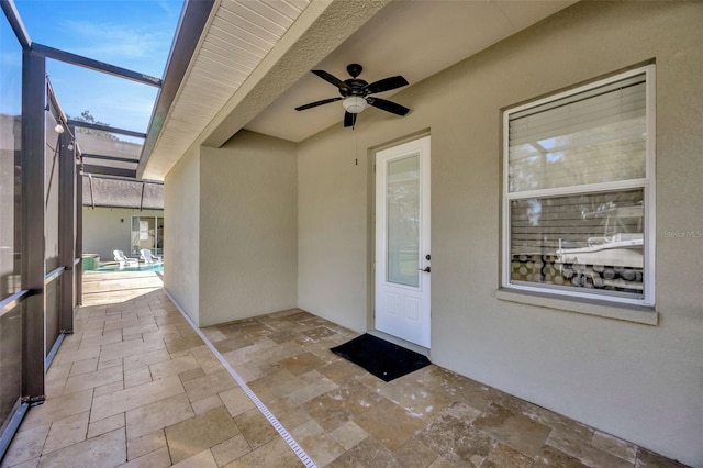 4411 Culbreath Rd, Valrico, FL 33596 - doorway to property with a patio area, stucco siding, and a ceiling fan